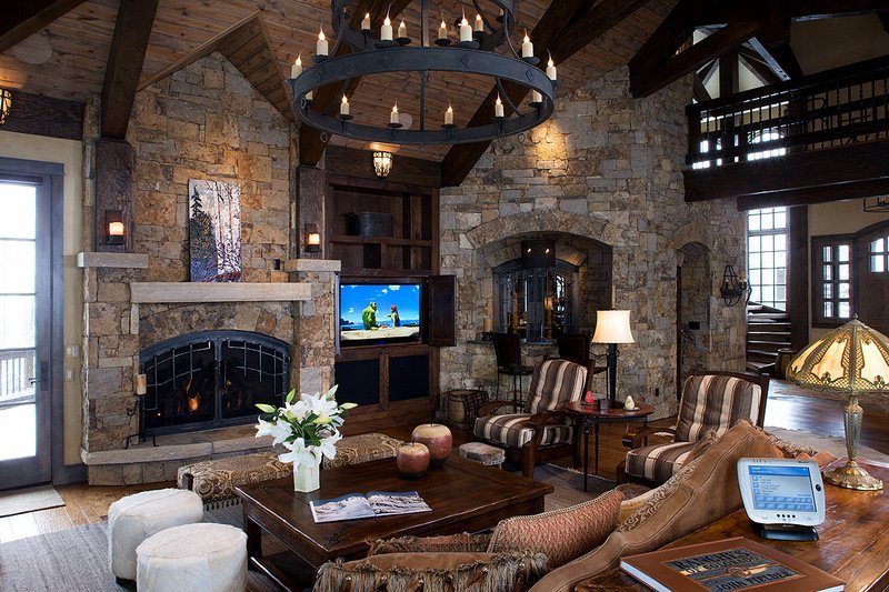 Stone fireplace and television in a timber mountain home