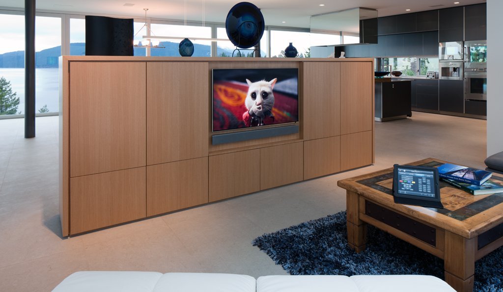 Television integrated into a wood room divider