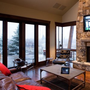 Mountain Multi-vision and Sound, Breckenridge, CO, mount Sony LCD television stone fireplace luxury ski-in vacation dream home Summit County, Colorado faux finish matches the Sonance speakers to the stone fireplace 